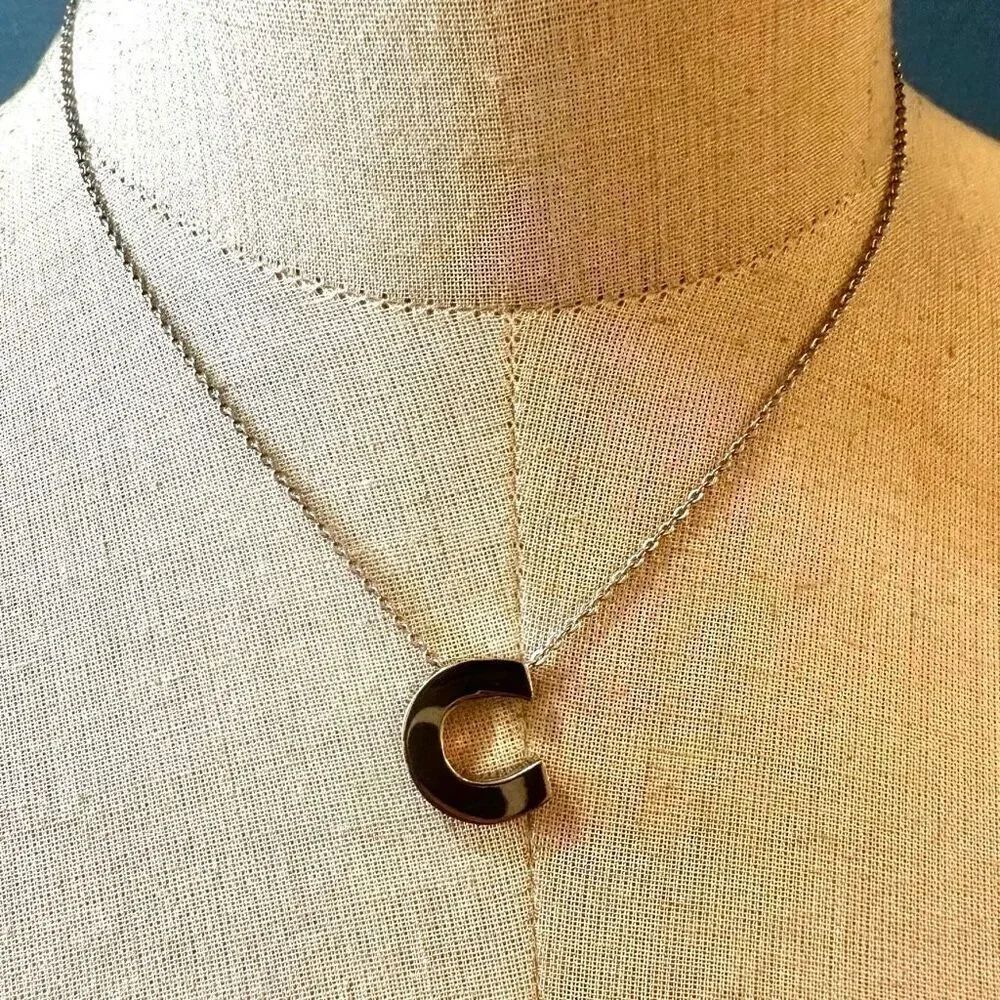 Silver tone C monogram pendant necklace